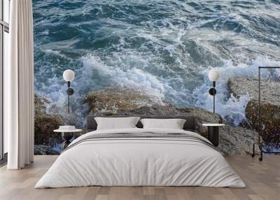 waves breaking on the shore with sea foam Wall mural