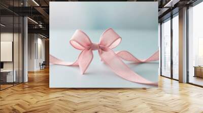 Pink Ribbon Bow on Light Blue Background. Wall mural