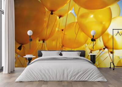 Inflatable yellow helium balloons party background Wall mural