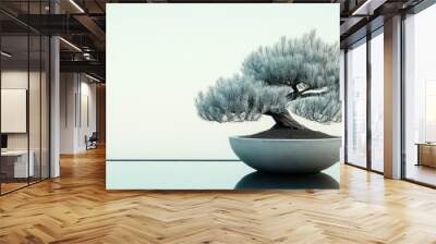 A bonsai tree in a minimalist white pot sits on a reflective surface with a blurred background of mountains and sky. Wall mural