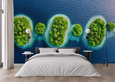 An aerial view of four small tropical islands in a chain formation surrounded by the clear blue water. Wall mural