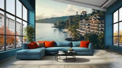 Luxury resort on a tropical beach with a view of the ocean and lush greenery. Wall mural