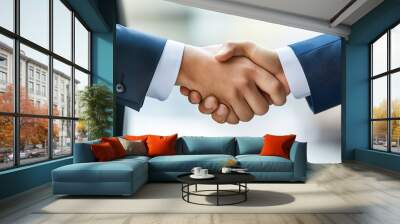 Two businessmen shaking hands in agreement, symbolizing partnership, collaboration, and success. Wall mural