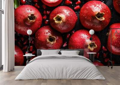 Pomegranate fruit with water drops on black background, top view.  Wall mural