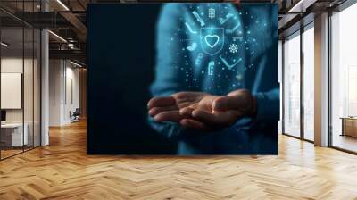 A person in a blue shirt demonstrating a floating holographic interface with various icons Wall mural