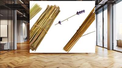 Various wooden incense sticks bundled together ready for spiritual practices and home fragrance on a white background Wall mural