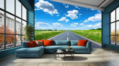 Low angle empty asphalt road on sunny day with blue sky Wall mural