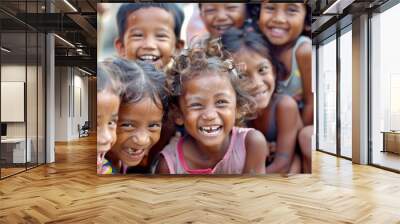 Portrait of a group of happy children smiling at the camera. Wall mural