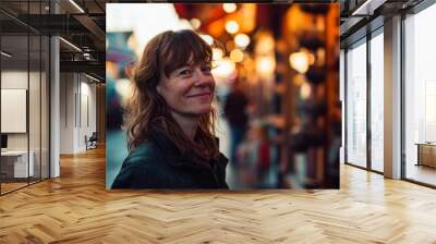 Portrait of a middle-aged woman on the background of the Christmas market Wall mural