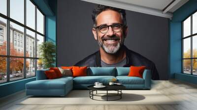 Portrait of a smiling middle-aged man in leather jacket and eyeglasses. Wall mural