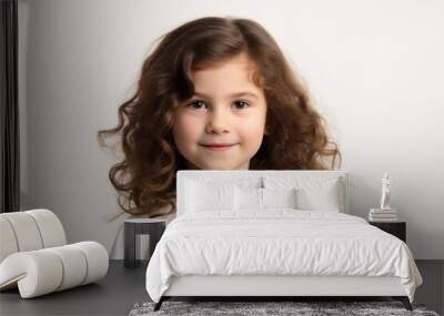 Portrait of cute little girl with long curly hair on white background Wall mural