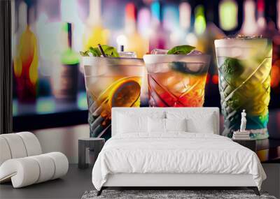 Colorful gin tonic cocktails in glasses on bar counter in pub or restaurant. Wall mural