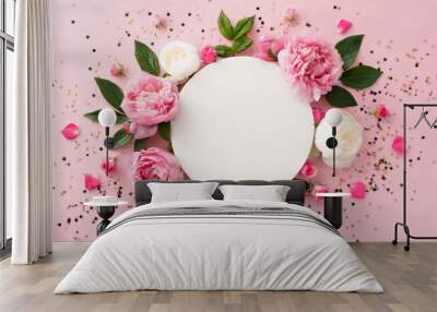 Top view of white empty circle and spring flowers pink roses on pink background with copy space Wall mural