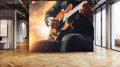 Guitarist on stage and sings in a concert for background, soft and blur concept. Wall mural