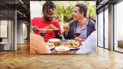 Friends eating chicken wings outdoors- happy people dining and talking together at the farmhouse restaurant outdoors - people, food and drinks lifestyle concept Wall mural