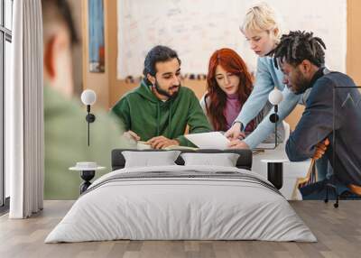 Group of diverse college students working together on a project in a classroom setting - Teamwork, diversity, and collaboration, with students engaged in discussion and study activities. Wall mural