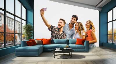 reunion gathering of generation z people having fun taking smartphone's selfie outdoors - isolated on white sky background - vacation and summer friendship carefree concept - vivid color filter Wall mural