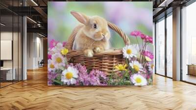 A cute little bunny is sitting in a basket of flowers Wall mural