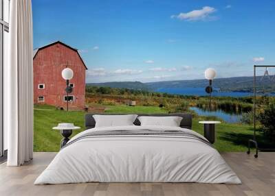 Vintage Abandoned Wooden Red Barn with Wine Vineyard and Lake in Background Wall mural