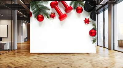 Two red dumbbells, training shoes, Christmas tree branches, decorative baubles ornaments. Healthy lifestyle Holiday season composition, festive flat lay concept with copyspace on white background. Wall mural