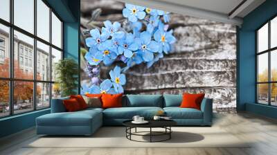 Bunch of beautiful blue forget me not flower on wooden table Wall mural