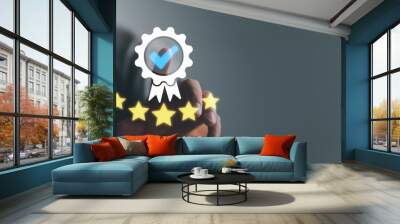 Businessman Hand shows the sign of the top service the best Quality assurance, Guarantee, Standards, ISO certification and standardization concept. guarantee product and ISO service concept. Wall mural