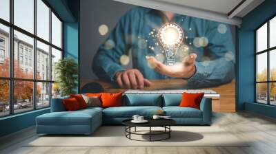 Innovation. Hands holding light bulb for Concept new idea concept with innovation and inspiration, innovative technology in science and communication concept... Wall mural