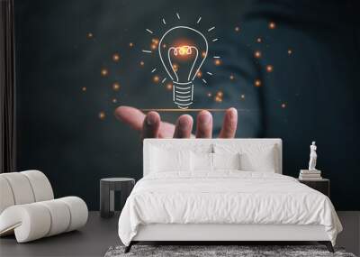 man holding icon light bulb,idea concept,,Presenting new ideas. Wall mural