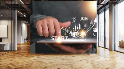 Startup concept with icon business and network connection on modern virtual interface from digital tablet. man touching on tablet. online business, e-comers, online marketing Wall mural