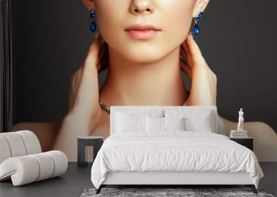 Beautiful woman with a sapphire necklace. Fashion concept Wall mural