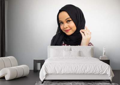 Asian hijab girl pose while smiling isolated on white background Wall mural