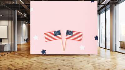 Two usa flag toothpick and star around on pink background, flat lay. 4th of july in America, celebration independence day in usa. Copy space for text in center. Wall mural