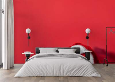 Red clock with Christmas Santa hat. Time for Christmas shopping concept. Blank copy space for text. Wall mural