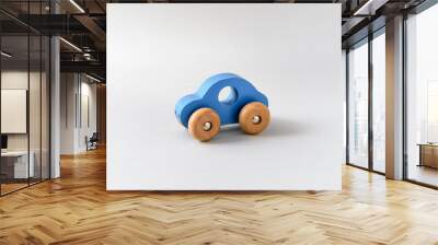 Blue wooden toy car on a white seamless background Wall mural