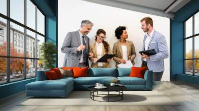 Group of diverse business people interacting in the office Wall mural