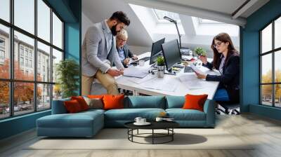 Group of young Architects Working at their Office Studio Wall mural