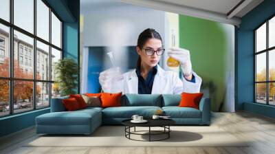 Young female researcher doing laboratory test Wall mural