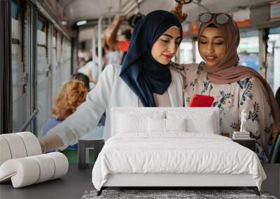 arab italian friends on the tram in italy - millennials women talking during the trip to the city wh Wall mural