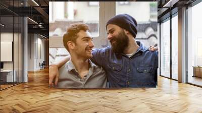 Couple of young men talking at the windows Wall mural