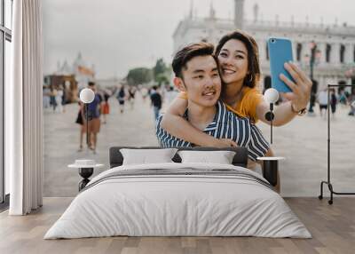 Loving couple in Venice, Italy - Millennials take a selfie in the city - Asian young people on vacation in Italy Wall mural