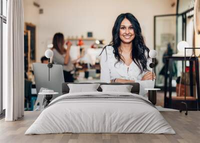 portrait of smiling woman standing in modern office Wall mural