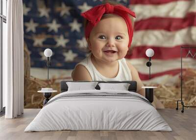 Adorable happy baby girl sitting on the ground holding an American flag, with a big big USA flag in barn as background Wall mural