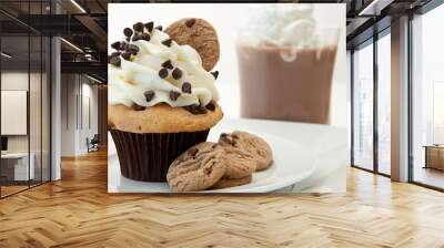 A Chocolate Chip Cookie Cupcake With Hot Chocolate In The Backgr Wall mural