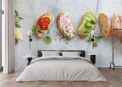 Breakfast sandwich bread with avocado, egg, radishes and tomatoes. Bruschetta or healthy snack ideas Wall mural