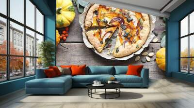 Galette with pumpkin, apple, red onion and pumpkin seeds. Overhead view, copy space. Wall mural