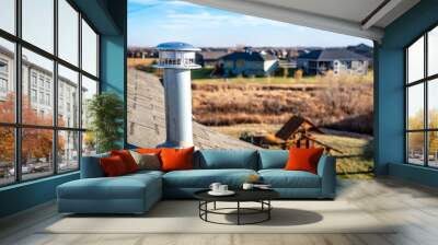 side view of a Galvanized metal chimney exhaust on  asphalt roof with a rain cap Wall mural