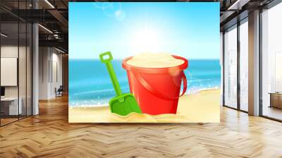 Bucket of sand and shovel on beach Wall mural