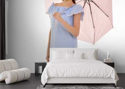 Pretty Teen Girl Walking under Pink Umbrella Against White Backg Wall mural