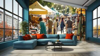 An outdoor flea market with colorful tents and a variety of goods for sale. Wall mural