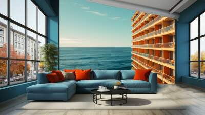 Endless rows of hotel balconies overlook the ocean, creating a beautiful seaside view for guests. Wall mural